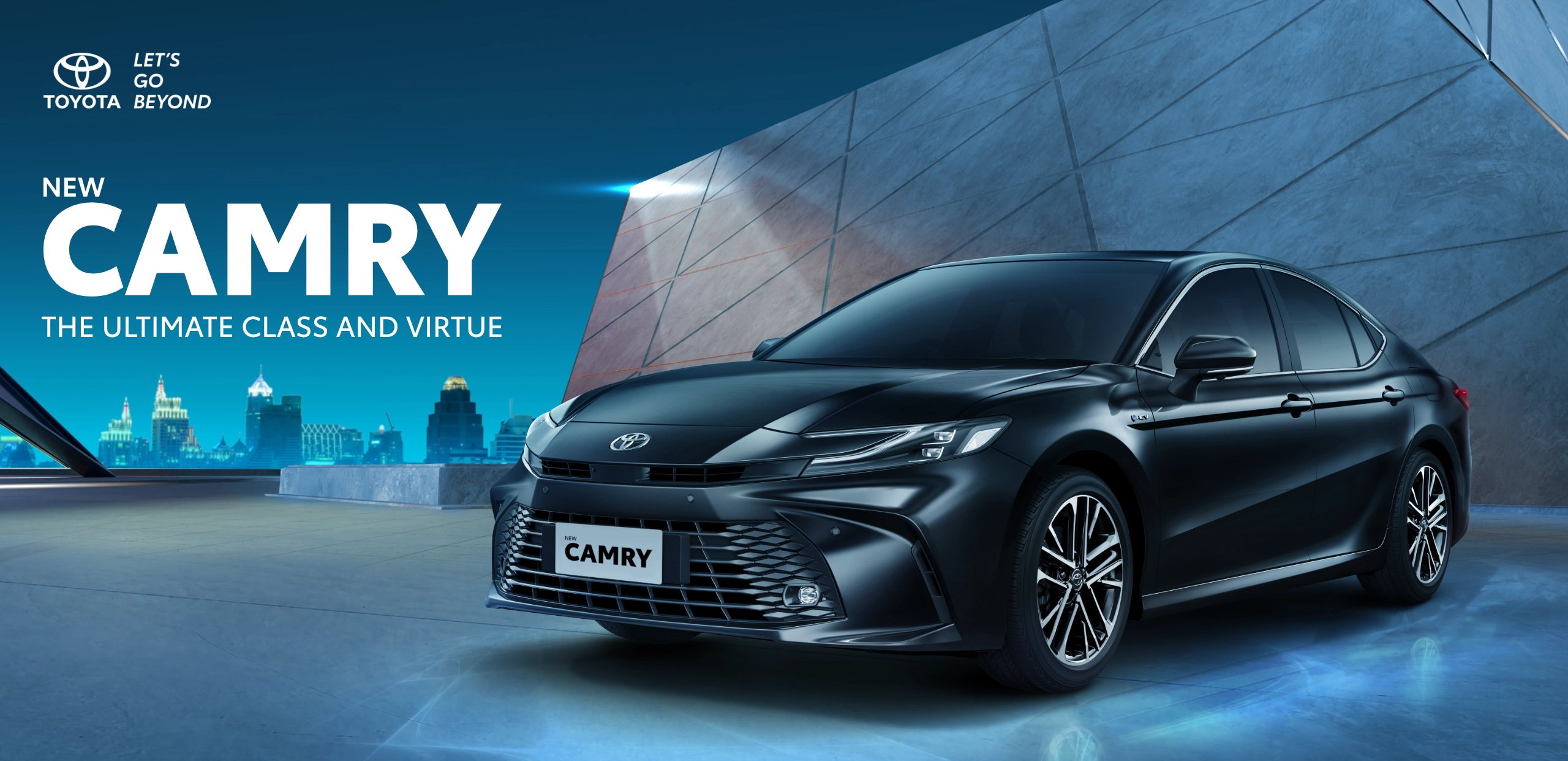 Banner promosi Toyota New Camry varian mesin bensin (Gasoline) warna hitam yang tampil elegan di area berdesain modern dengan latar belakang siluet perkotaan malam, memuat tagline The Ultimate Class and Virtue.