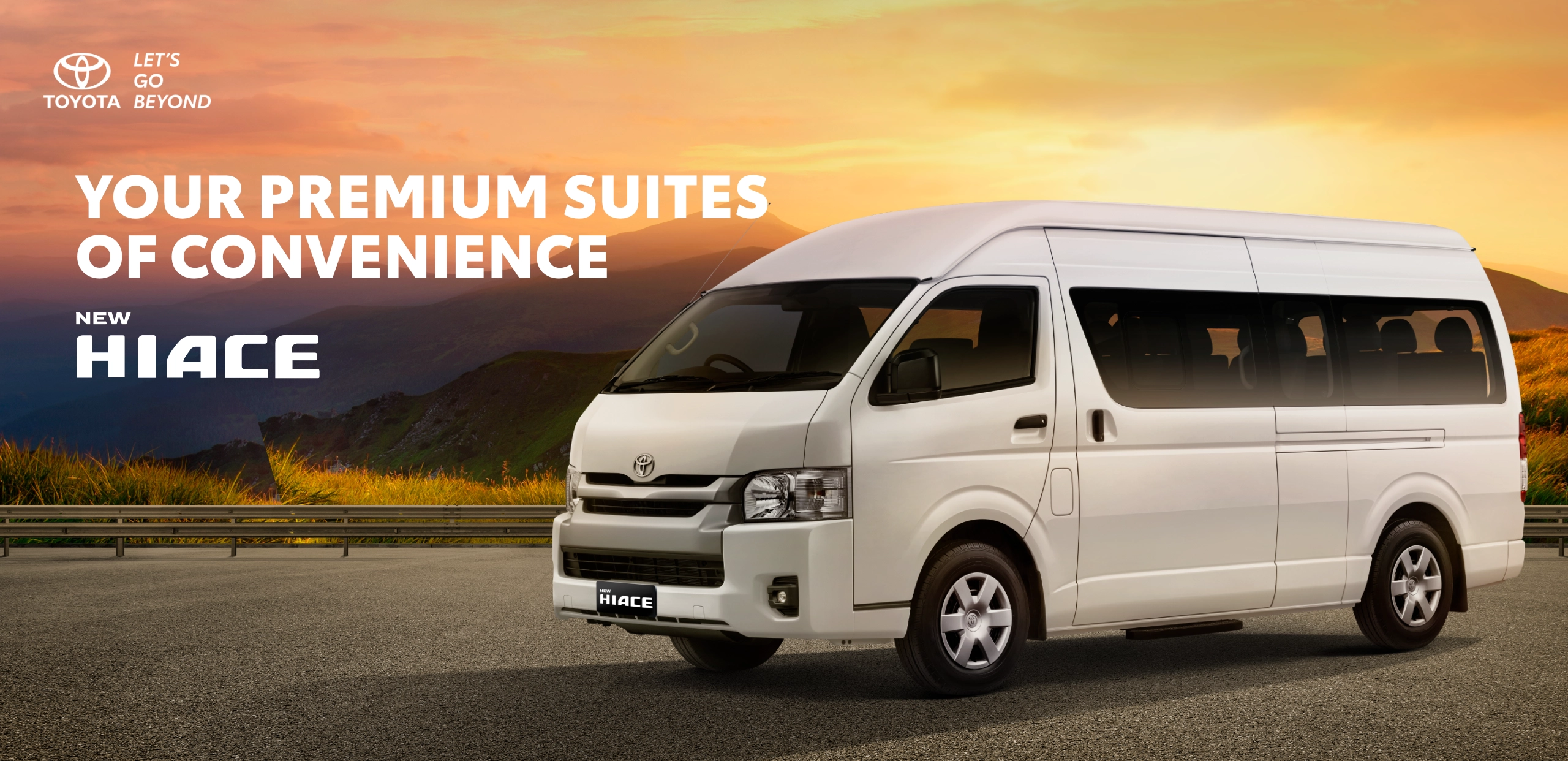 Banner promosi Toyota New Hiace warna putih yang melaju mulus di jalanan pegunungan dengan latar belakang pemandangan senja, memuat tagline Your Premium Suites of Convenience.