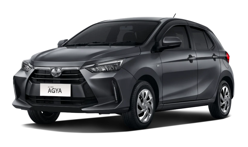 Mobil Toyota All New Agya Tipe E varian warna abu-abu gelap, tampak serong depan menampilkan desain standar yang fungsional dengan latar belakang putih.